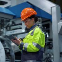 Female steel worker with a hard hat
